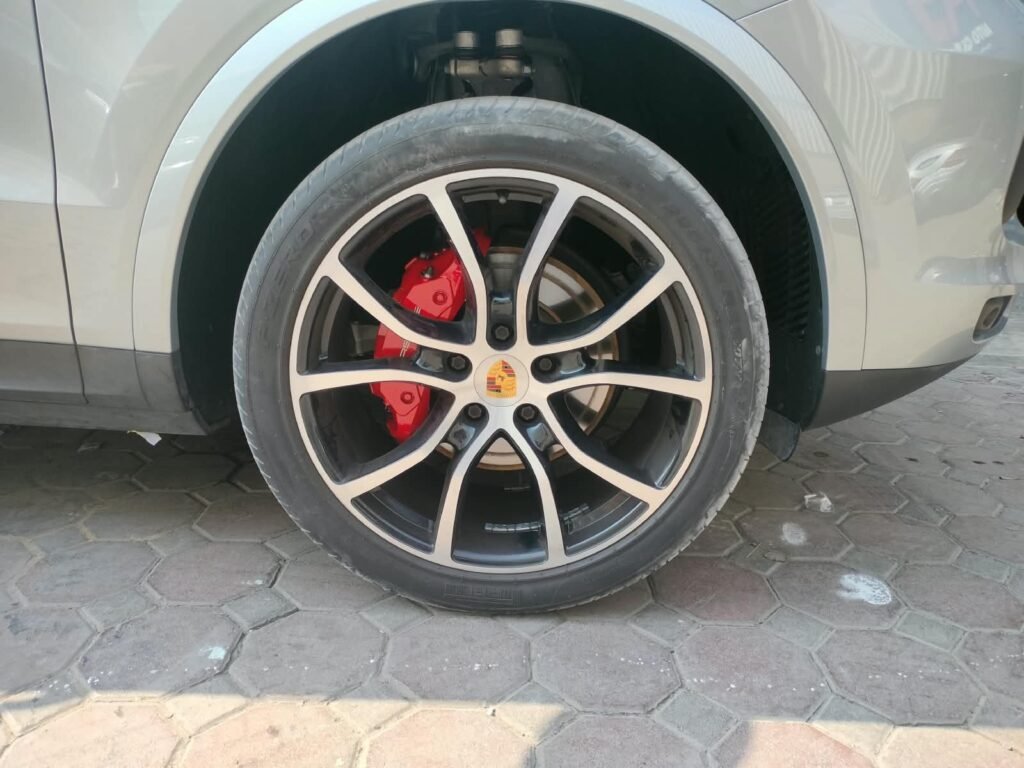 Porsche wheel with red calipers after brake caliper painting in Dubai