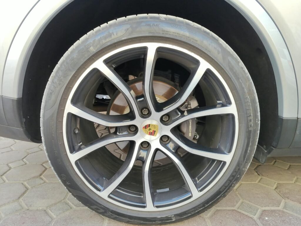 Porsche wheel with original grey caliper before brake caliper painting