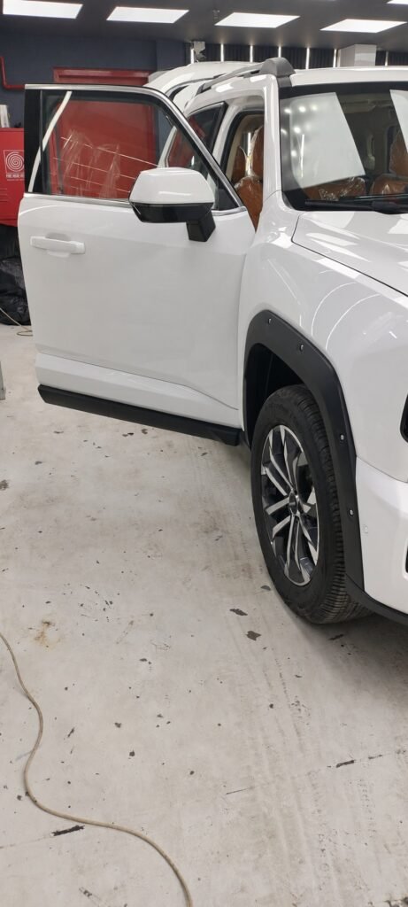 White SUV bodywork and front quarter at Wrapex Car Care in Dubai